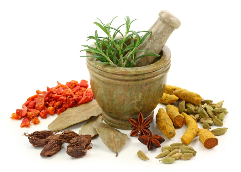 Mortar with fresh rosemary and dried spices